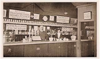 Bar, Leeds Canteen, near Masham, Yorkshire, ca. 1900. Gothenburg pubs
promoted food, non-alcoholic beverages and sobriety, sometimes as here in an
aggressive way amid an austere environment.