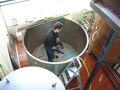 Brewer Nick Webster cleaning the mash tun
