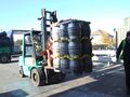 Diesel fork lift clamp truck taking casks to the line