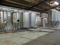 FVs and liquor tanks and then the brewplant on the right behind the large fermenters