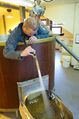 Brewer Paul McCluskey clears the spent grain chute