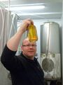 Head Brewer Malcolm Downie inspects for clarity